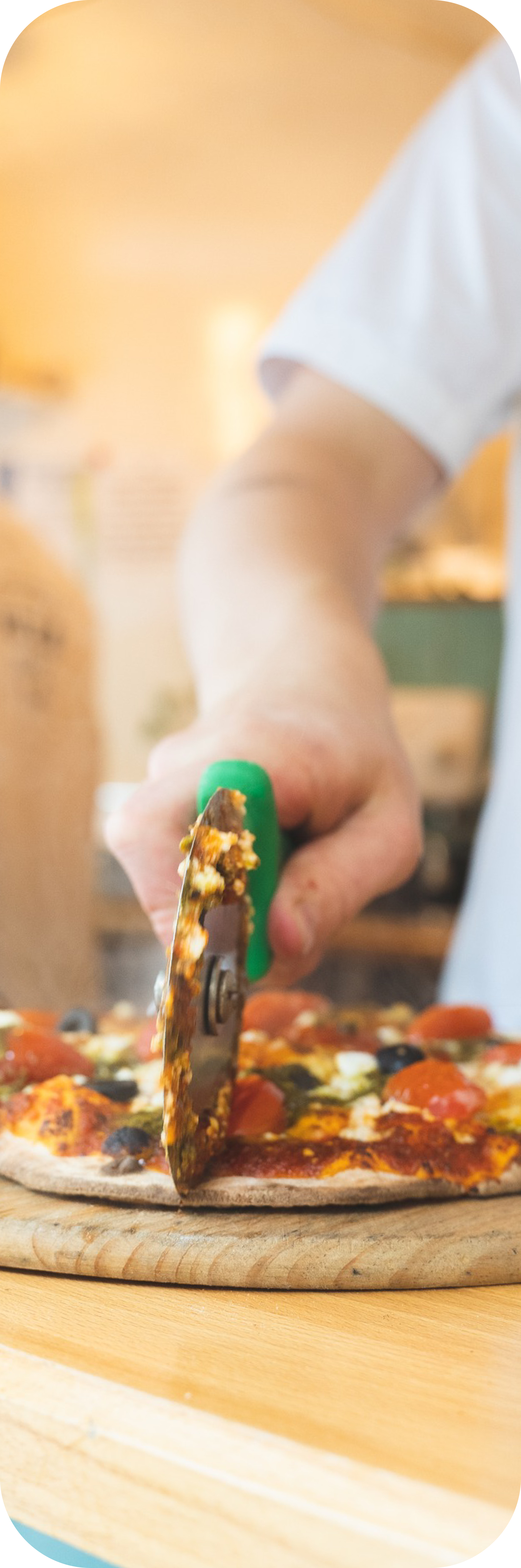 Pizza being sliced